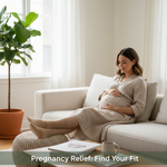 Pregnant woman sitting comfortably, wearing a compression sock, representing relief and support. Guide to choosing 15-20 mmHg vs 20-30 mmHg compression for pregnancy.