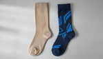 Medical compression stocking and athletic recovery sock displayed side by side for comparison