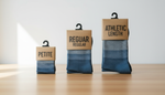 Compression sock packages in petite, regular, and athletic lengths arranged for size comparison