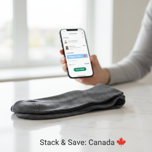 A neatly folded pair of compression socks with a smartphone showing a promo code field, symbolizing savings. Image for "Compression Socks Promo Codes in Canada: Real Codes, Stacking Tactics, and Safer Ways to Save".