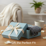 A beautifully wrapped gift box with stylish compression socks peeking out, representing the perfect fit for a thoughtful present. Image for "How to Buy Compression Socks as a Gift: A Sizing & Style Guide".