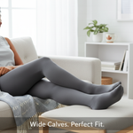A person's lower legs wearing perfectly fitted wide-calf compression socks in a comfortable home setting, emphasizing relief and support. Article on sizing and deals in Canada.